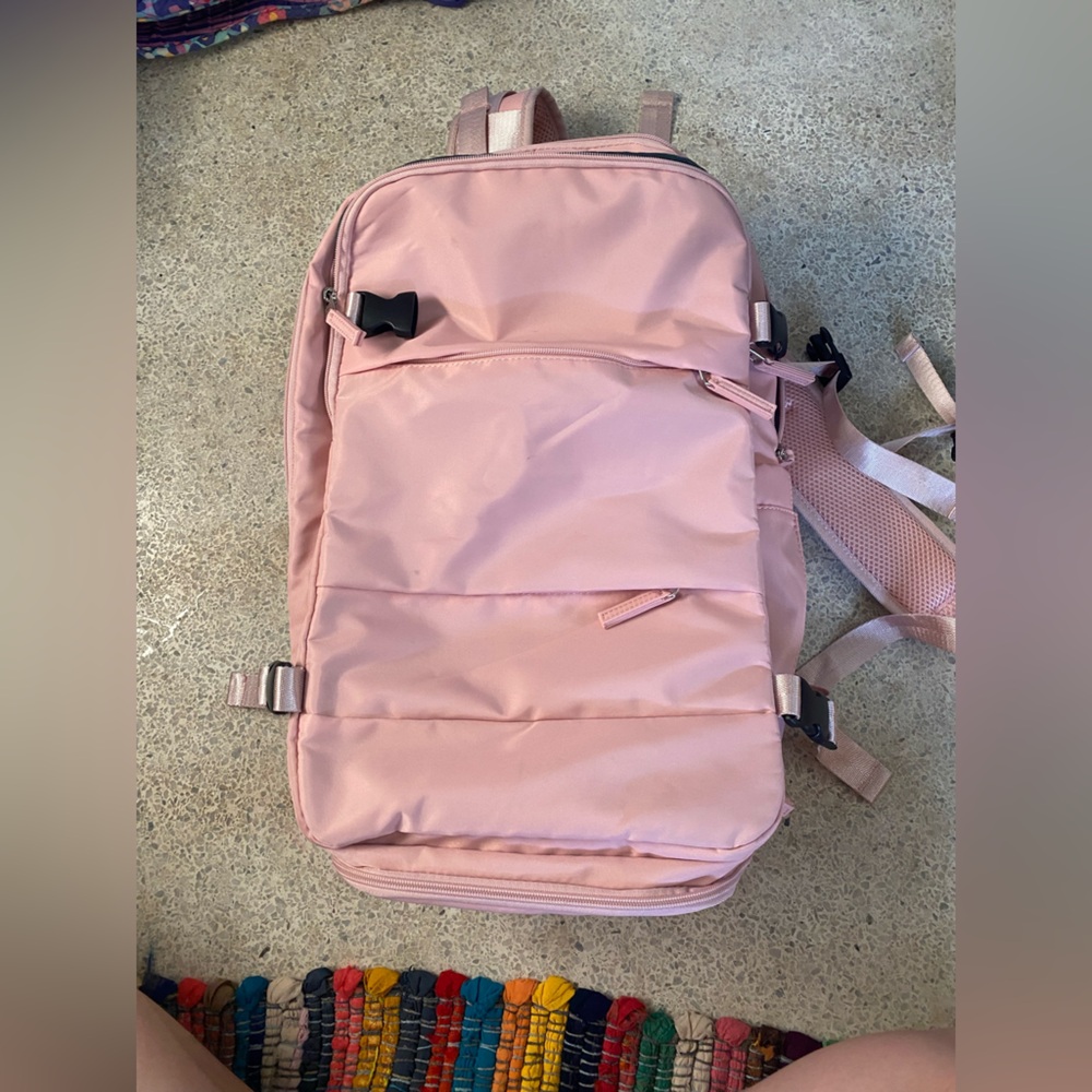 Multiple pocket backpack. Fits carryon requirements for most airlines. Used once